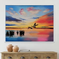 Designart 'Crane Birds Flying During Colorful Sunset' Nautical & Coastal Framed Canvas Wall Art Print